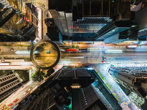 Car Traffic On Road Junction Intersection In Hong Kong City Downtown At Night. Drone Aerial Top View. Asian People Lifestyle, Asia City Life Or Public Transportation Concept