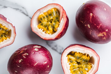 Ripe passion fruit, half and slice of fruit on a white  background.