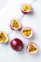 Ripe passion fruit, half and slice of fruit on a white  background.