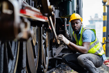 American engineer male engineer inspects and inspects trains and inspects work in a railway station...