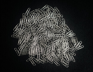 paper clips on black background