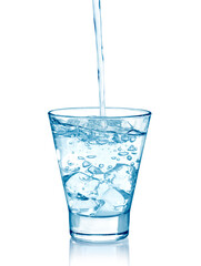 pouring water on a glass on white background	
