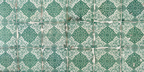 Traditional green and white ornate portuguese decorative tiles azulejos