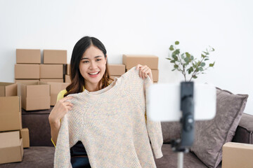 Young woman showcasing product for online sale.