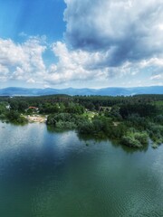 Fototapeta na wymiar Water, lake, dam, beautiful scenery and clouds - near Kazanlak in Bulgaria 