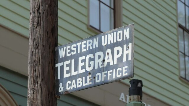 Historic Western Union, metal sign in front of a period hotel