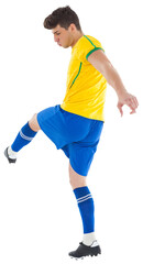 Digital png photo of caucasian male football player kicking on transparent background