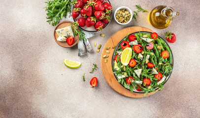 Summer healthy food, Strawberry arugula salad. Fresh diet fruit strawberry salad. Long banner format. top view