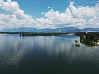 Fototapeta premium The Koprinka dam - massive reservoir (lake) near the town of Kazanlak with the Balkan mountains in the backdrop