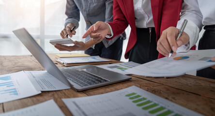 business team discussion of reports displayed in charts and graphs. analyze financial statistics...