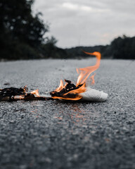  Newspaper burst in flames in the midle of the road