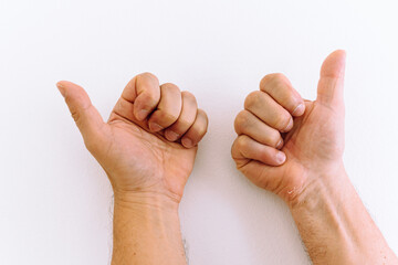 Male hands with calluses, palms forward, fingers bent