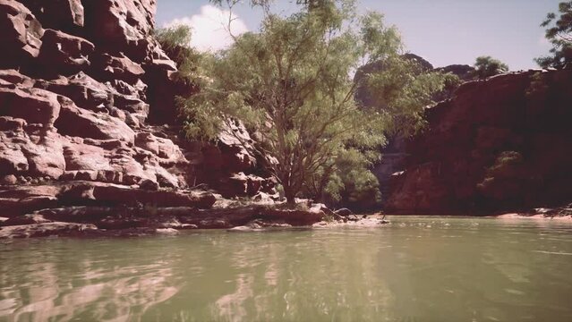 beautiful day on the river with sandstone cliffs and reflections