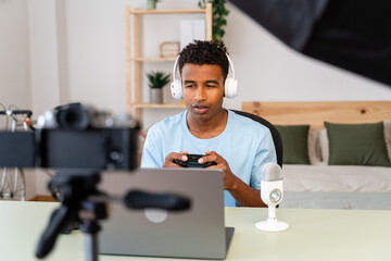 Fototapeta na wymiar Male streamer recording online video game at home.