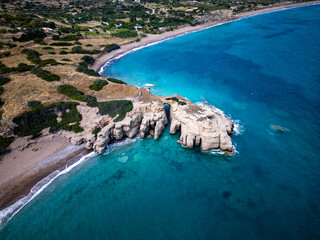 Paralia Limni Beach on the island of Kythira in Greece with stone arches and blue water