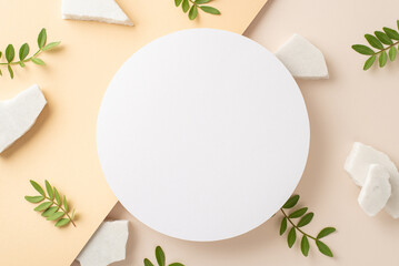 Fototapeta na wymiar Herbal cosmetics concept. Above view photo of empty circle surrounded by eucalyptus branches and white marble stones on isolated two-colored beige background with copyspace