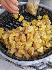 Fresh Steamed Dumplings In a steaming place, on a vending cart, sold by villagers in Thailand.