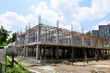 BANGKOK, THAILAND - June 20, 2023 : The construction of new building in the city with blue sky background in the city. Construction Concept in Thailand.