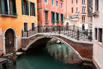 Obraz na płótnie Canvas Narrow canal with a bridge in Venice, Italy
