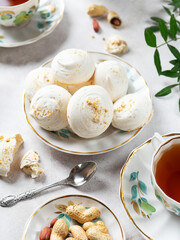 French dessert Meringue prepared from whipped with sugar and baked eggs.A cup of home-made meringues