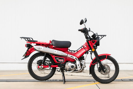 Bangkok, Thailand - 3 June ,2020:Red motorcycle New Honda CT125 Country Trekking on the road in Bangkok, Thailand