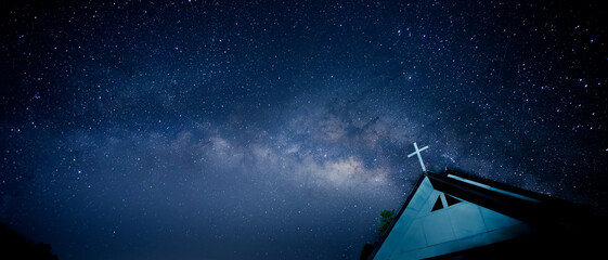 Milky way with cross on the church's roof.