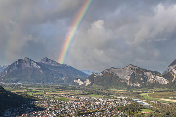 Panorama of the city of Bad Ragaz against the background of the Swiss Alps with rainbow. Bad Ragaz Switzerland. Aerial view. Top view