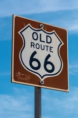 Fototapete Route 66 Route 66 sign with blue sky in background and text space  © idoerenberg