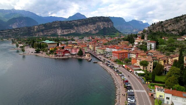 Scenic Garda lake,  popular beautiful town and resort Torbole. aerial drone overflight 4k video. Trentino, Lago di Garda, Italy