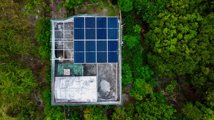 Solar panel on the roof. Aerial view of the roof of a building with a solar panel. Building in the...