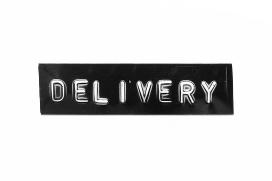 Black color banner that have embossed letter with word delivery on white paper background
