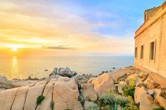 The old lighthouse at sunset on the Capo Testa peninsula, Sardinia, Italy