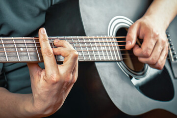 Obraz na płótnie Canvas Man playing the acoustic guitar
