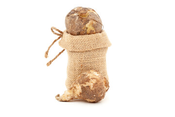 Close-up of Wild Organic onion or Indian squill (Drimia indica), in a jute bag. Isolated over white background.