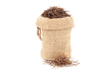 Close-up of Dry Organic Amar Bel (Cuscuta reflexa) roots, in a jute bag. Isolated over white...