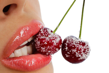 Closeup of young woman eating red cherries covered by sugar