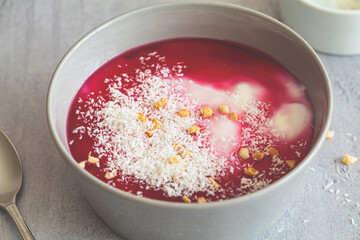 Malabi - traditional Arabic dessert. Milk pudding with rose syrup and nuts.