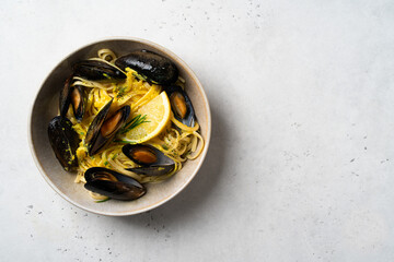 Plate with musse, lemon and rosemary on white background