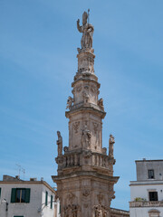 Fototapeta na wymiar column representing Sant'Oronzo in Ostuni, Italy