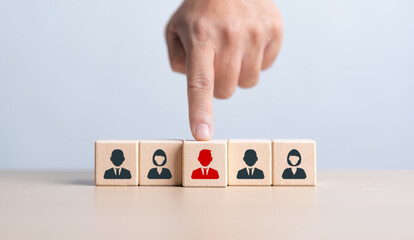 HR or Manager hand choosing man people icons on wooden cube blocks. Business hiring and recruitment...