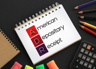 ADR American Depositary Receipt - certificate issued by a U.S. bank that represents shares in foreign stock, acronym text  on notepad concept background - obrazy, fototapety, plakaty