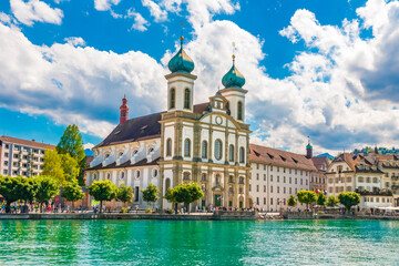 Beautiful view of the Lucerne Jesuit Church St. Francis Xavier at the river Reuss with turquoise...