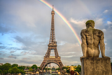 Fototapeta na wymiar The Eiffel Tower after the rain fall with a beautiful rainbow ,on the evening
