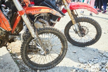 Motorsport, motorcycle wheel in the mud. Mountain motorcycling. Adventures on the track