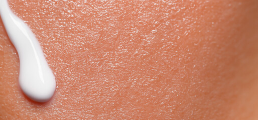 Close up of Sunscreen Protection or Sun Cream on human skin. Skin and Body Care. SPF Lotion or...