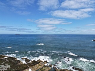 Aerial view of waves crashing onto rocks in Dunbar on the east  coast of Scotland. 