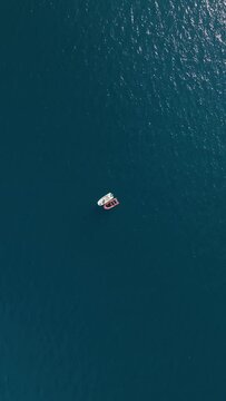 Vertical Video: Overhead Capture of Patrol Boat at Sea