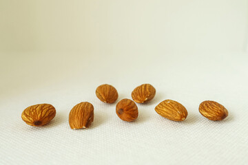 Almond nuts on a white background. Top view. Copy space.