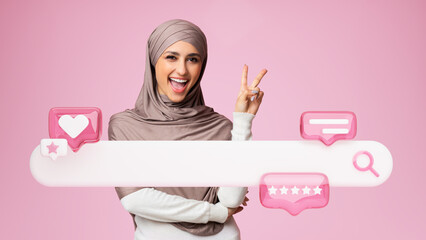 Woman In Hijab Gesturing Victory Near Search Bar, Pink Background