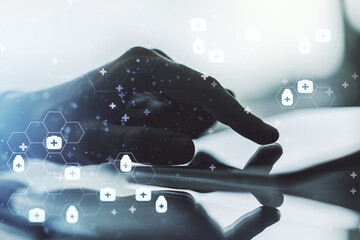 Double exposure of creative abstract medical hologram and finger clicks on a digital tablet on background. Healthcare technolody concept